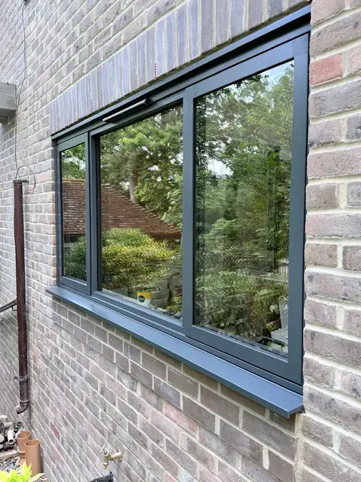 Dark grey aluminium replacement windows installed by Team Frames in Surrey