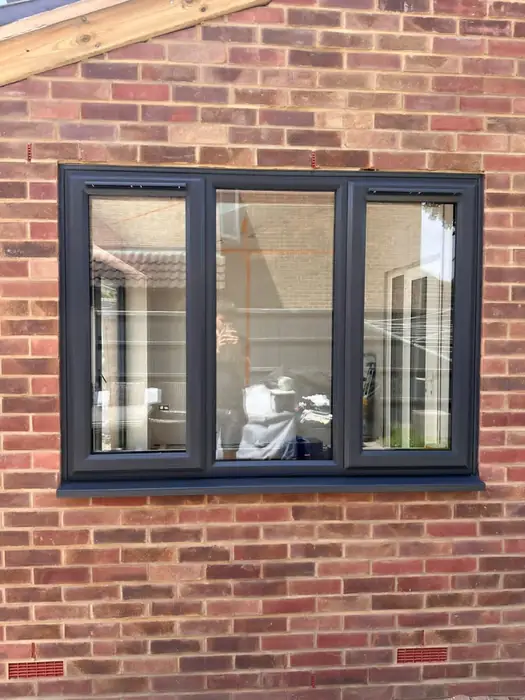 Dark grey aluminium replacement windows installed by Team Frames in Surrey