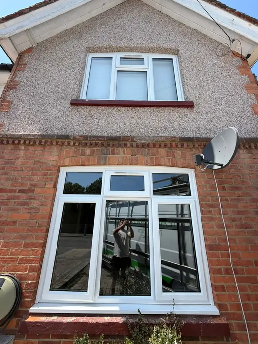 White uPVC casement windows fitted to a semi-detached house by Team Frames