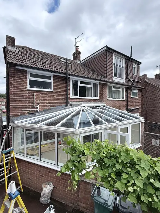 White conservatory with glazed roof completed by Team Frames