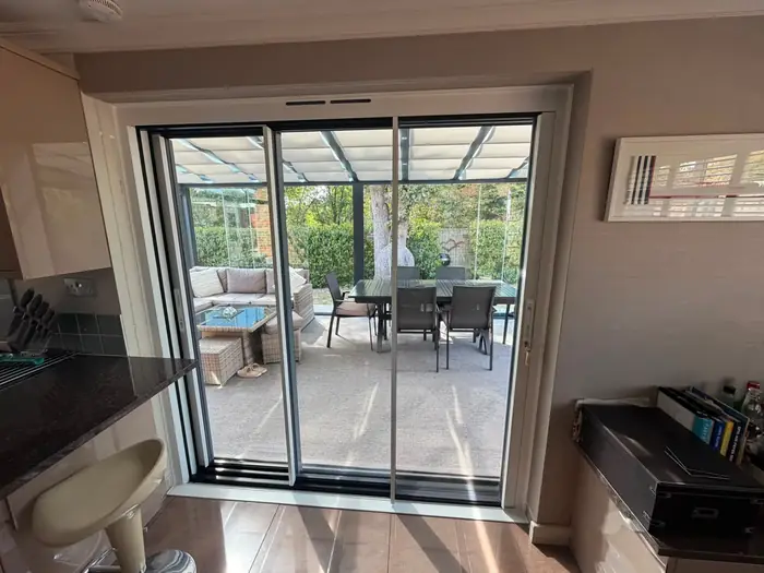 Sliding patio doors seen from inside a kitchen, installed by Team Frames