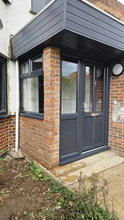 Anthracite grey porch with glazed side panels built by Team Frames