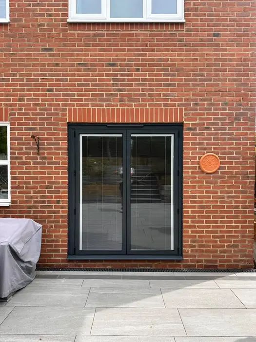 Aluminium French doors with integral blinds installed by Team Frames