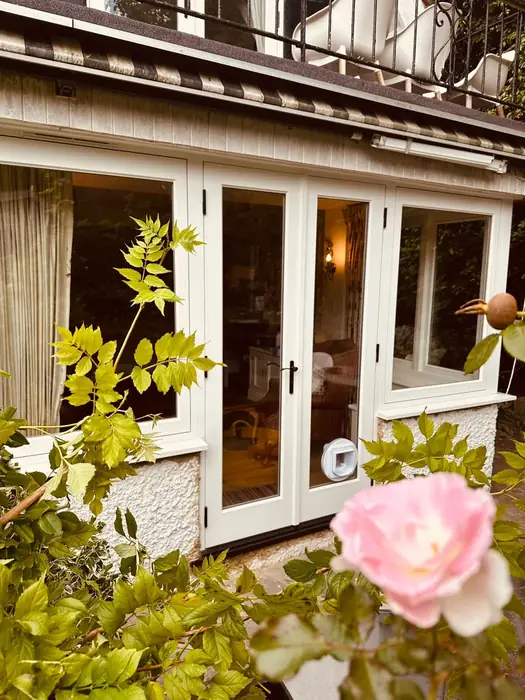 White French doors on a cottage elevation fitted by Team Frames