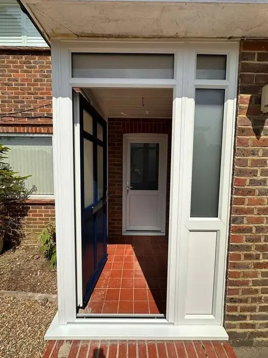 White uPVC porch with entrance door built by Team Frames in Surrey