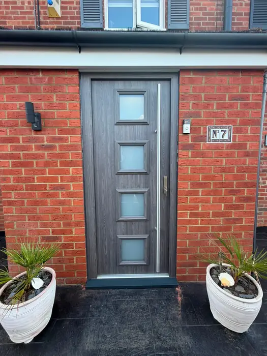 Composite front door with glazed panels installed by Team Frames